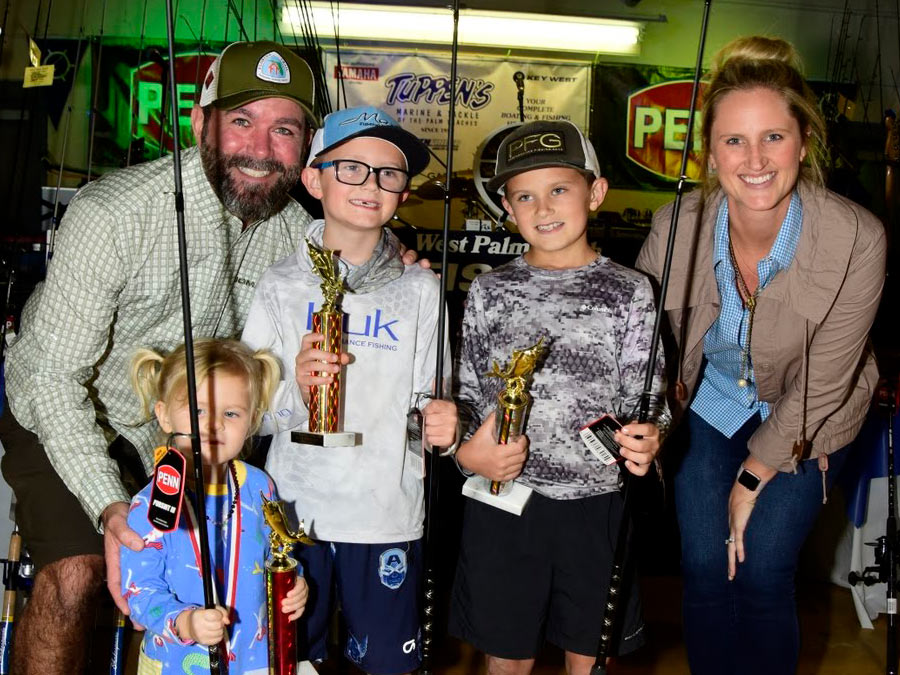 Family with fishing trophies
